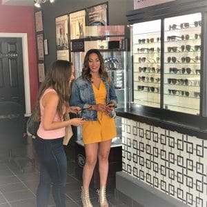 Ladies laughing while trying sunglasses on for Condo commercial filming