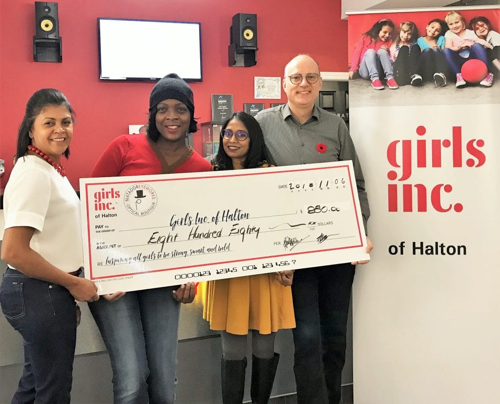 Donating cheque to girls inc. of Halton Charity
