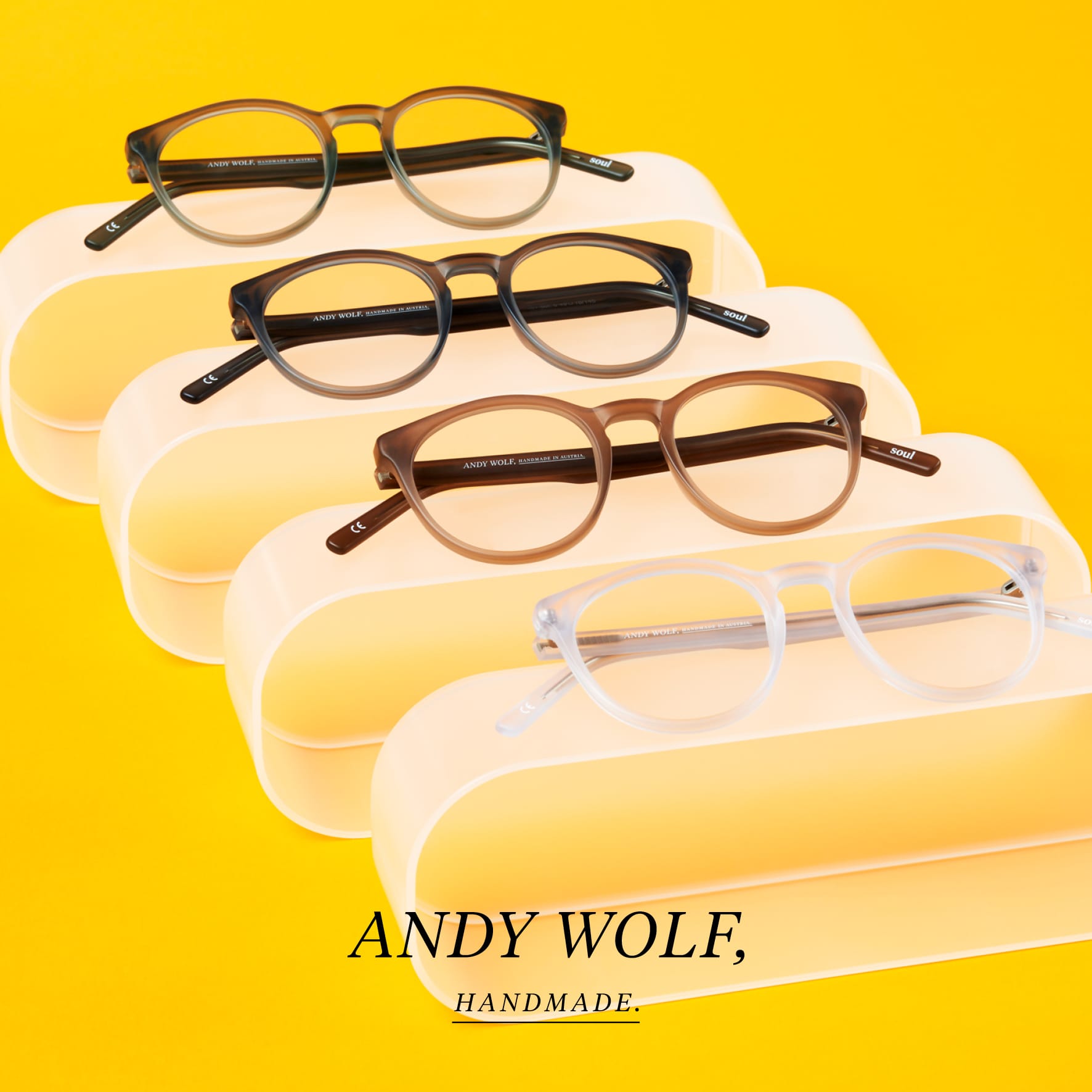 Beautiful hand made eyeglasses by Andy Wolf yellow background